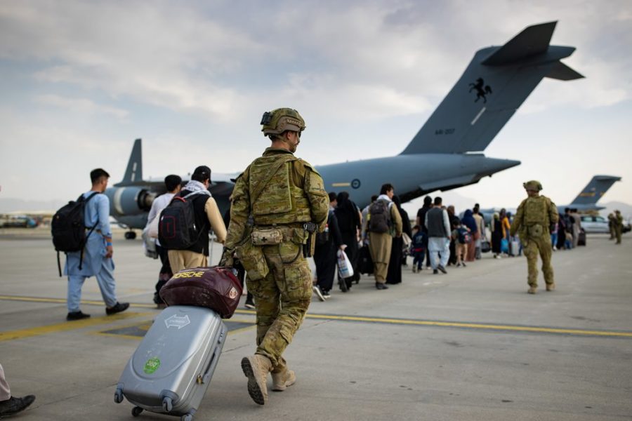 Troops and citizens evacuate Afghanistan after the the withdrawal of troops in 2021.