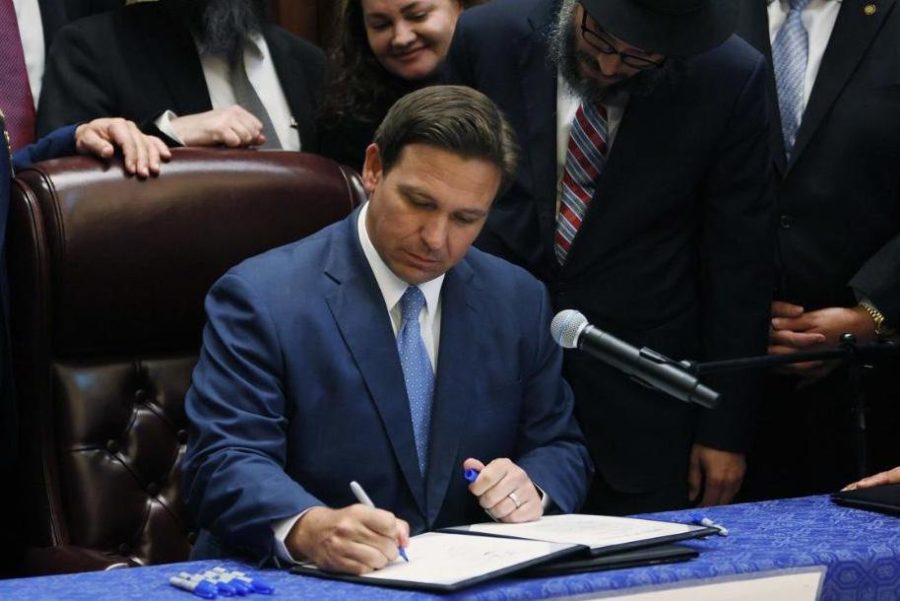 State Governor Ron DeSantis signs bill mandating moment of silence.