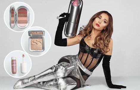 Ariana Grande poses with her new makeup line called r.e.m. beauty.