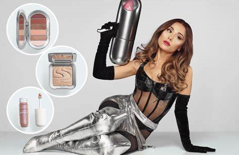 Ariana Grande poses with her new makeup line called "r.e.m. beauty."