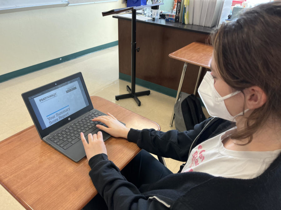 Charlotte Kimmerling looks at her PSAT/NMSQT score report on December 6. 