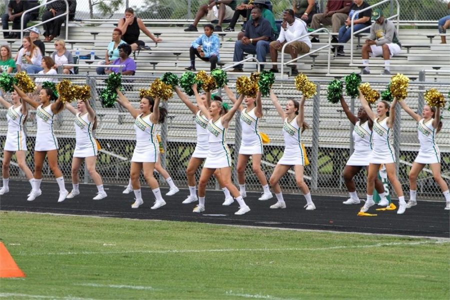 Suncoast cheerleaders perform at a football game. 