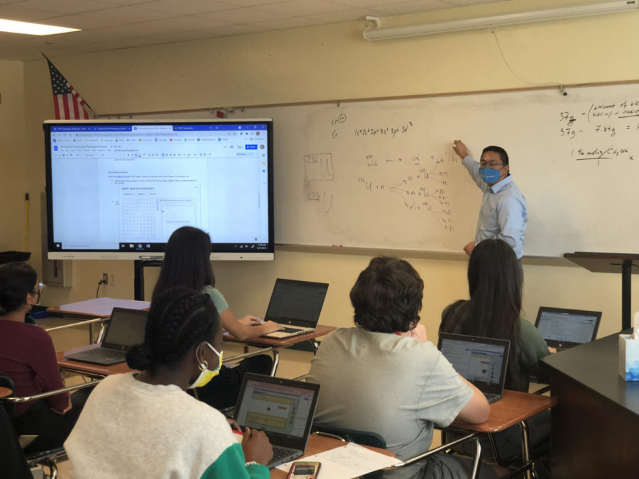 Penserga teaches MYP chemistry to his fifth period class while also managing a political campaign for mayor. 