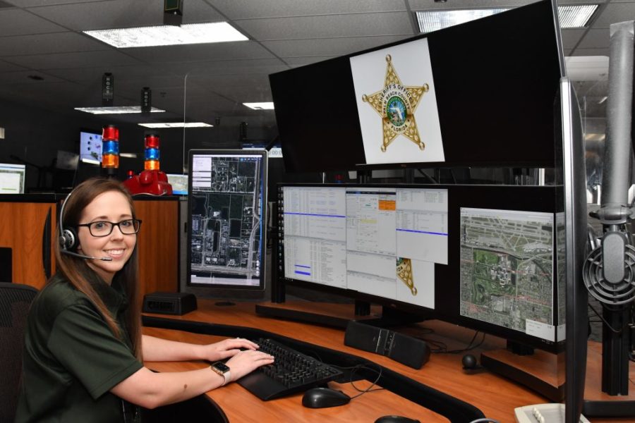 A 911 operator for the Palm Beach County Sheriffs Office trained in helping solve emergencies over the phone. 
