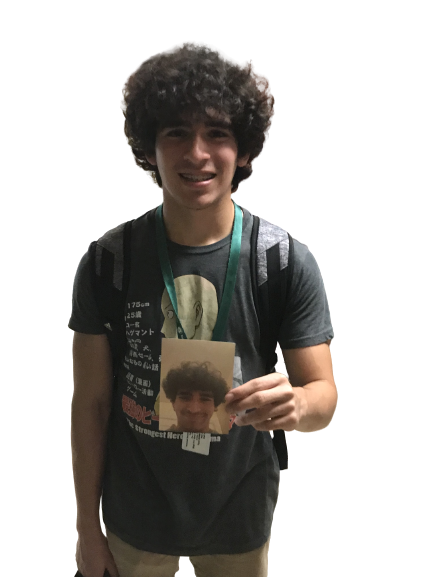 Vincenzo holding the photo that is being placed around the School 